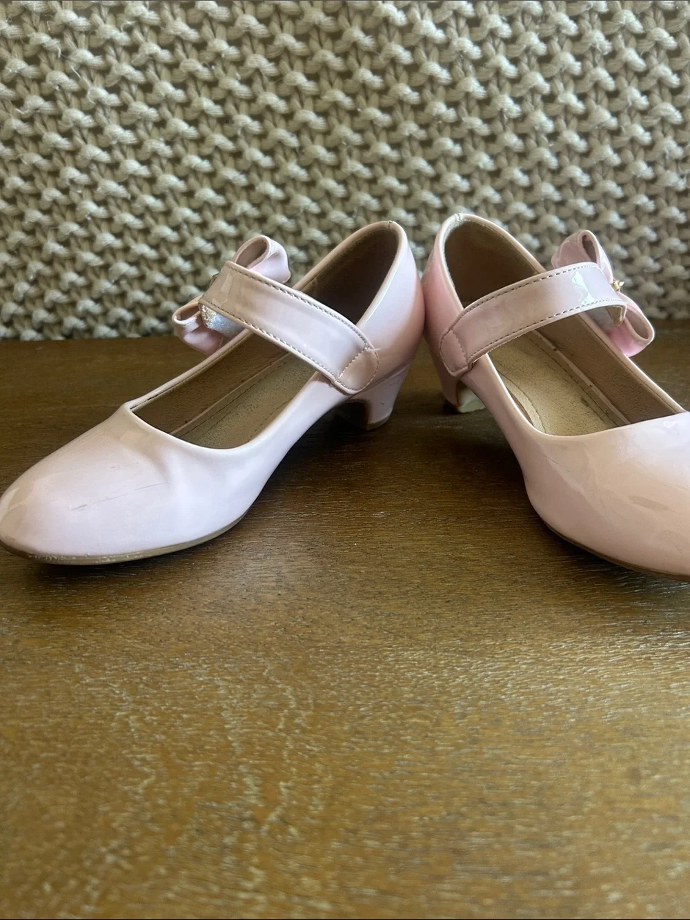 Pale pink shiny Maryjane heels with bow clasp. Perfect for fancy or dress up!